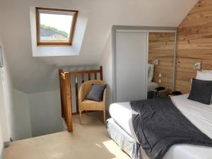 Postel nebo postele na pokoji v ubytování Hôtel de la Mer