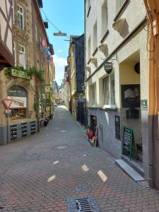 an empty street in a city with buildings at Pension Winnemuller in Cochem