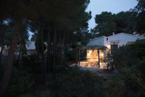 a backyard at night with a gazebo at Quinta la Sal in Jávea
