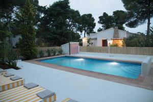 a swimming pool in the backyard of a house at Quinta la Sal in Jávea