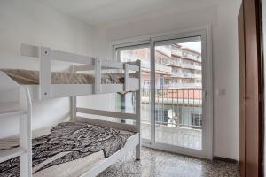 Posteľ alebo postele v izbe v ubytovaní Albatros Apartament per 5 persones en ple centre amb gran terrassa i aparcament a 5 minuts de la Platja Gran