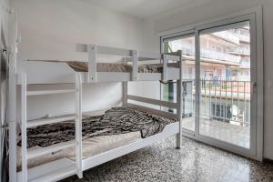 Posteľ alebo postele v izbe v ubytovaní Albatros Apartament per 5 persones en ple centre amb gran terrassa i aparcament a 5 minuts de la Platja Gran