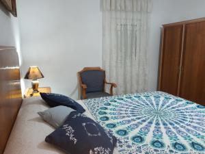 A bed or beds in a room at Casa de Pascual