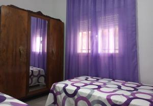 A bed or beds in a room at Casa de Pascual