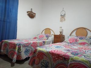 A bed or beds in a room at Casa de Pascual