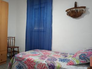 A bed or beds in a room at Casa de Pascual