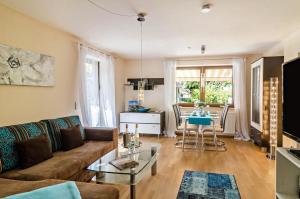 a living room with a couch and a table at Ferienwohnung Wolf Überlingen in Überlingen
