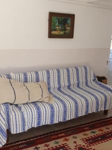 a couch in a room with a picture on the wall at Afales View in Vathi