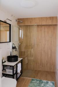 a bathroom with a sink and a shower at Apartment Frana in Komarna +15 photos