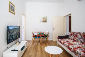 a living room with a couch and a table at Clarinet Old Town Dubrovnik in Dubrovnik