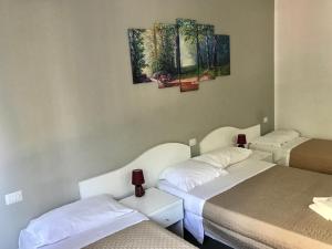 Postel nebo postele na pokoji v ubytování Guest House Brianza Room