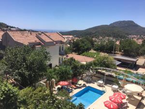 a hotel with a swimming pool and a resort at Sunset Apart Otel in Oludeniz