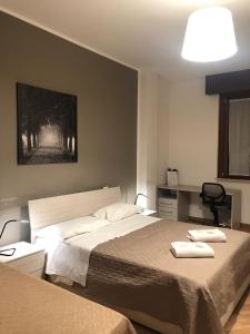 Postel nebo postele na pokoji v ubytování Guest House Brianza Room
