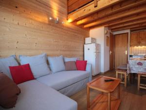 a living room with a couch and a table at Appartement Hauteluce, 3 pièces, 6 personnes - FR-1-293-9 in Hauteluce