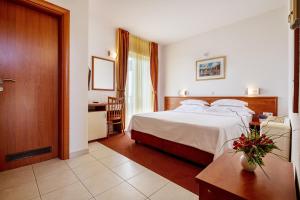 Postel nebo postele na pokoji v ubytování Hotel Posejdon