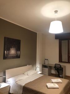 Postel nebo postele na pokoji v ubytování Guest House Brianza Room