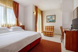 Postel nebo postele na pokoji v ubytování Hotel Posejdon