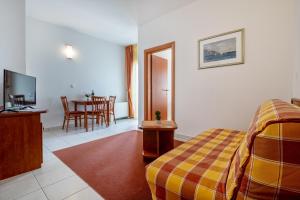 TV a/nebo společenská místnost v ubytování Hotel Posejdon