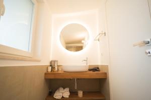 a bathroom with a sink and a mirror at B&B La Ferula in Altamura +45 photos