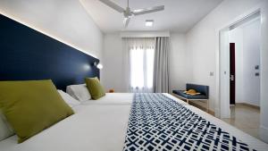 Broncemar Beach Suites客房内的一张或多张床位