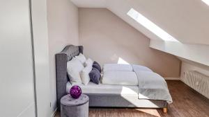 Postel nebo postele na pokoji v ubytování Penthouse im Dachgeschoss