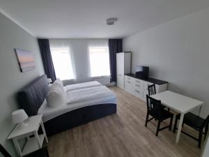 Postel nebo postele na pokoji v ubytování Nikolai Appartements