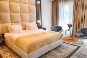 Posteľ alebo postele v izbe v ubytovaní Grand Focus Hotel Szczecin