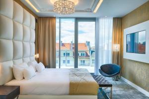 Posteľ alebo postele v izbe v ubytovaní Grand Focus Hotel Szczecin