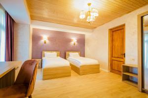 Katil atau katil-katil dalam bilik di Hotel Mestia Inn
