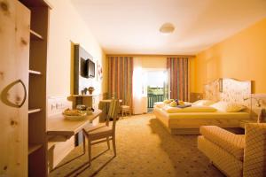 Posteľ alebo postele v izbe v ubytovaní Thermenhotel PuchasPLUS Stegersbach