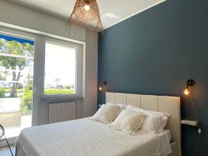 Ein Bett oder Betten in einem Zimmer der Unterkunft Casa Blu litorale Andora