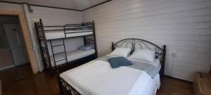 a bedroom with two bunk beds in a room at Новый дом целиком 800м от моря за городом в тихом уютном месте in Chornomorsk