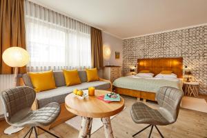 Postel nebo postele na pokoji v ubytování Dolomit Boutique Hotel