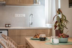 A kitchen or kitchenette at Margiani Studio & Apartment