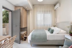 A bed or beds in a room at Margiani Studio & Apartment