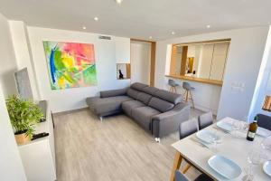 a living room with a couch and a table at Central Modern Apartment 3 bed 2 bath in El Campello +37 photos