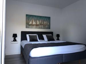 a bedroom with a large bed with sails on the wall at Ada Vis Apartments in Vis