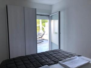 Postel nebo postele na pokoji v ubytování Ada Vis Apartments