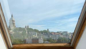 a window with a view of a city at Studio Vieille Ville in Boulogne-sur-Mer