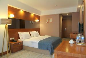 Postel nebo postele na pokoji v ubytování Kilpa Hotel