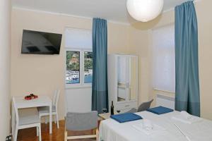 Postel nebo postele na pokoji v ubytování Studio Porty