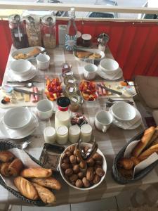a table topped with lots of different types of food at Cannes City B&B in Cannes