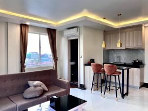 a living room with a couch and a table at Twin Hotel in Kampot