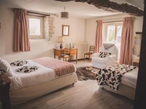 Ένα ή περισσότερα κρεβάτια σε δωμάτιο στο La Maison Periot