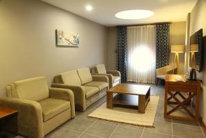 TV a/nebo společenská místnost v ubytování Kilpa Hotel