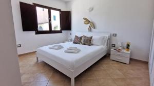 Posteľ alebo postele v izbe v ubytovaní Welcomely - La Terrazza sul Faro