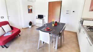 Kuchyňa alebo kuchynka v ubytovaní Welcomely - La Terrazza sul Faro