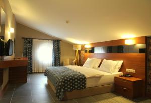 Ένα ή περισσότερα κρεβάτια σε δωμάτιο στο Kilpa Hotel