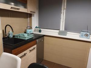 Kuchyň nebo kuchyňský kout v ubytování Apartament Flaming