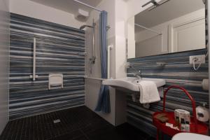 a bathroom with a sink and a mirror at Bed and Breakfast Terra del Sole Ibla in Ragusa +123 photos